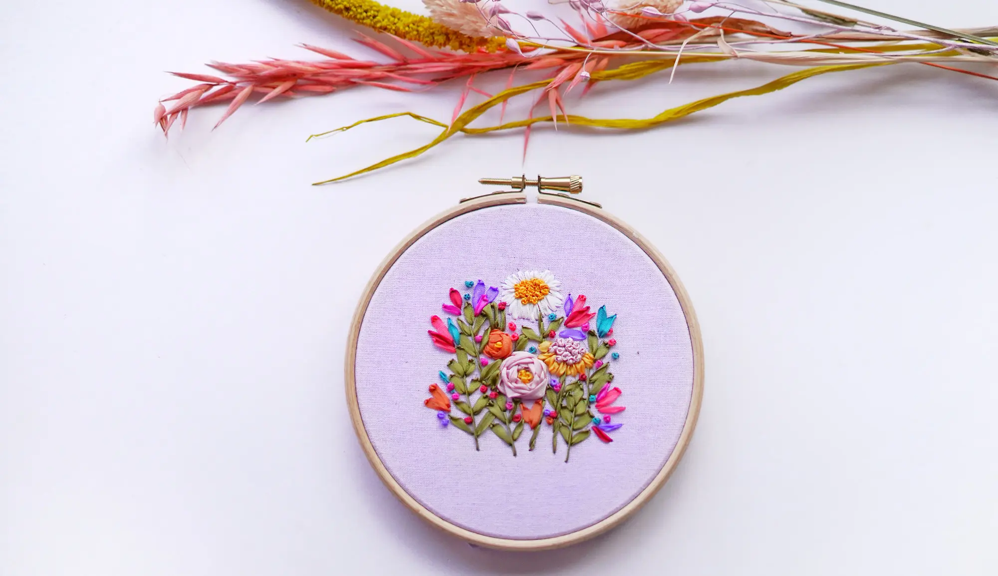 Designing ribbon embroidery kits, crafted for creating stunning silk ribbon art.